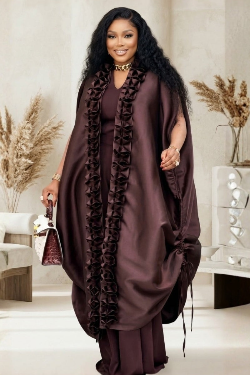 Woman showcasing the Divine set in a luxurious brown color with stylish ruffles and elegant appeal.